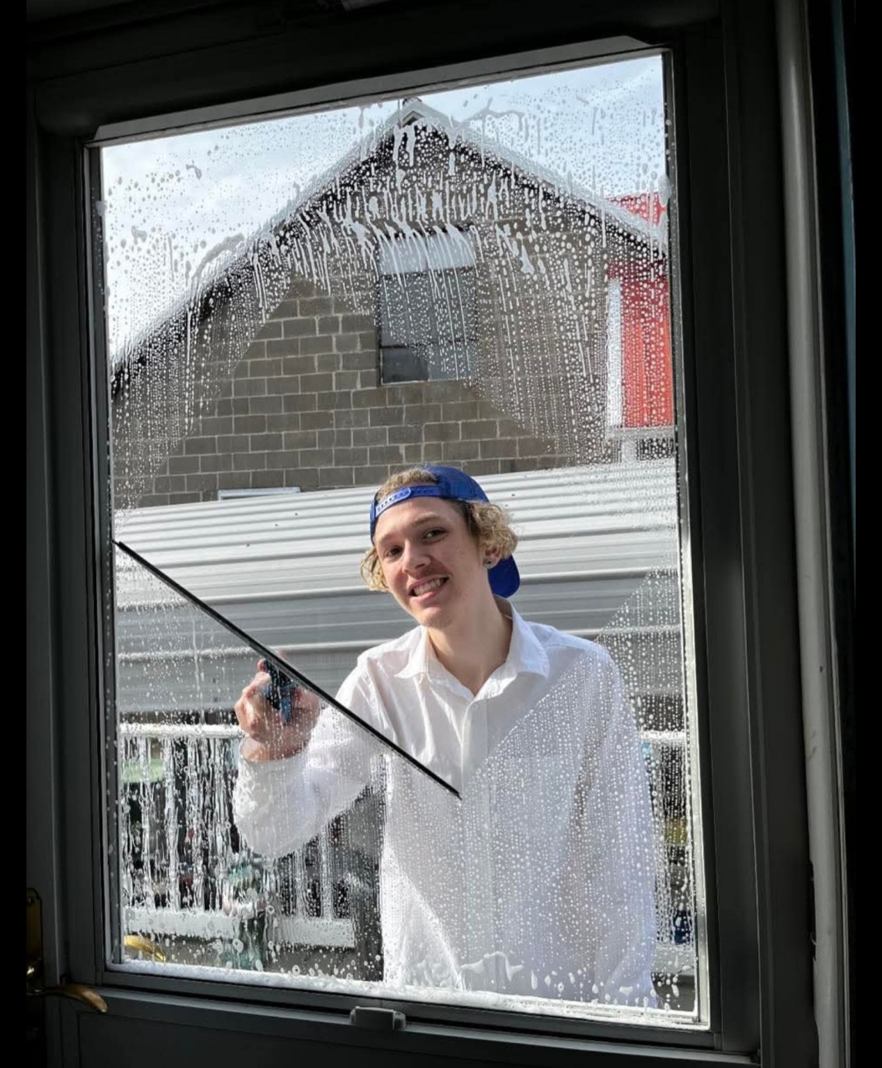 Shaun cleaning a window during the early Birds Beware years