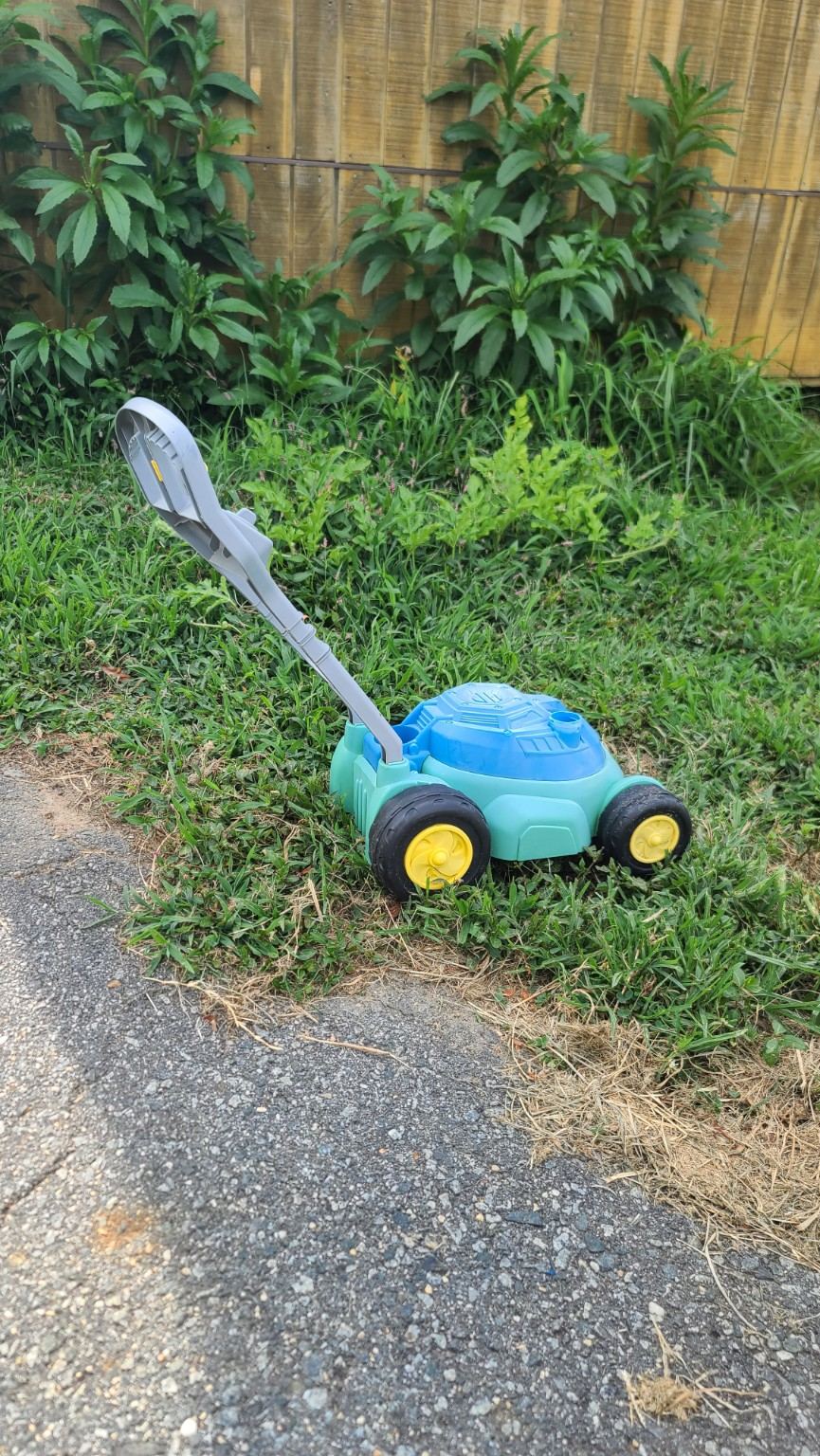 Small toy mower that represents the early Birds Beware story