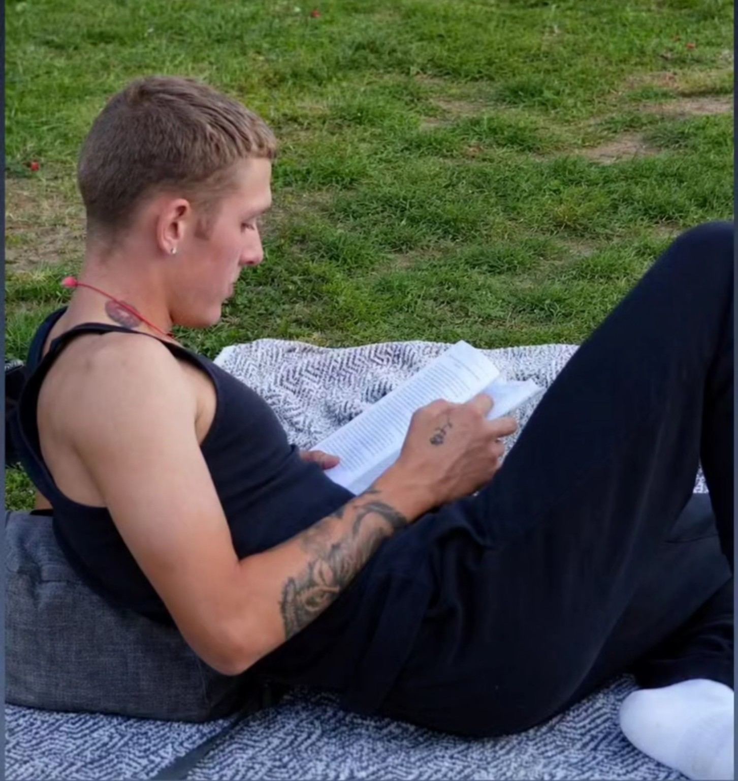 Shaun reading outdoors